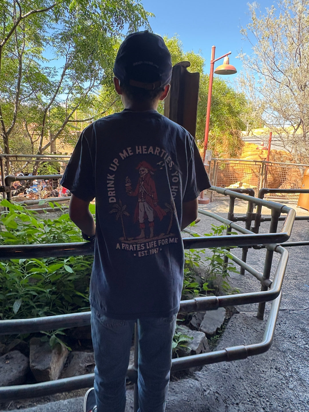 A boy in his Pirates Coffee Life tee at the park