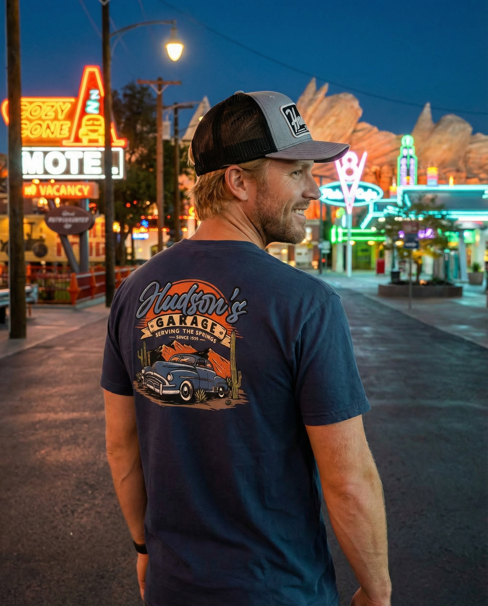 Corner of Main Hudson's Garage 2.0 cotton T-shirt, open front view with graphic design on white fabric.