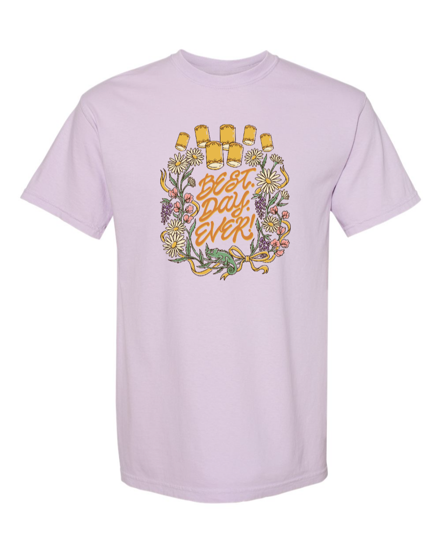 Corner of Main Best Day Ever! 100% cotton T-shirt featuring a vibrant orchid graphic on the front.