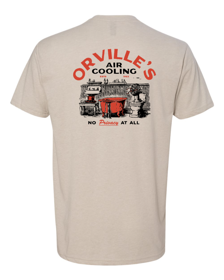 Corner of Main Orville's Air Cooling T-Shirt featuring Carousel of Progress design on sandy background.