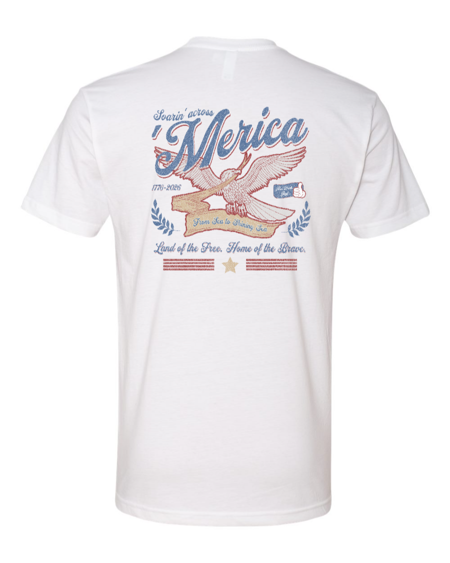 White Next Level T-shirt by Corner of Main featuring a "Soarin' Across 'Merica" graphic on the back.
