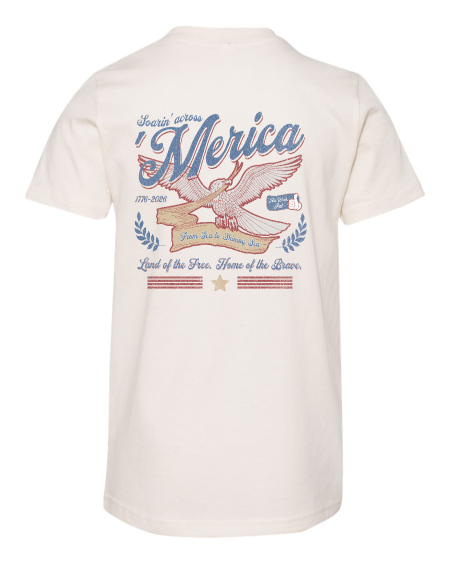 Kids' youth tee by Corner of Main featuring a natural-colored back design with patriotic "Soarin' Across 'Merica" print.