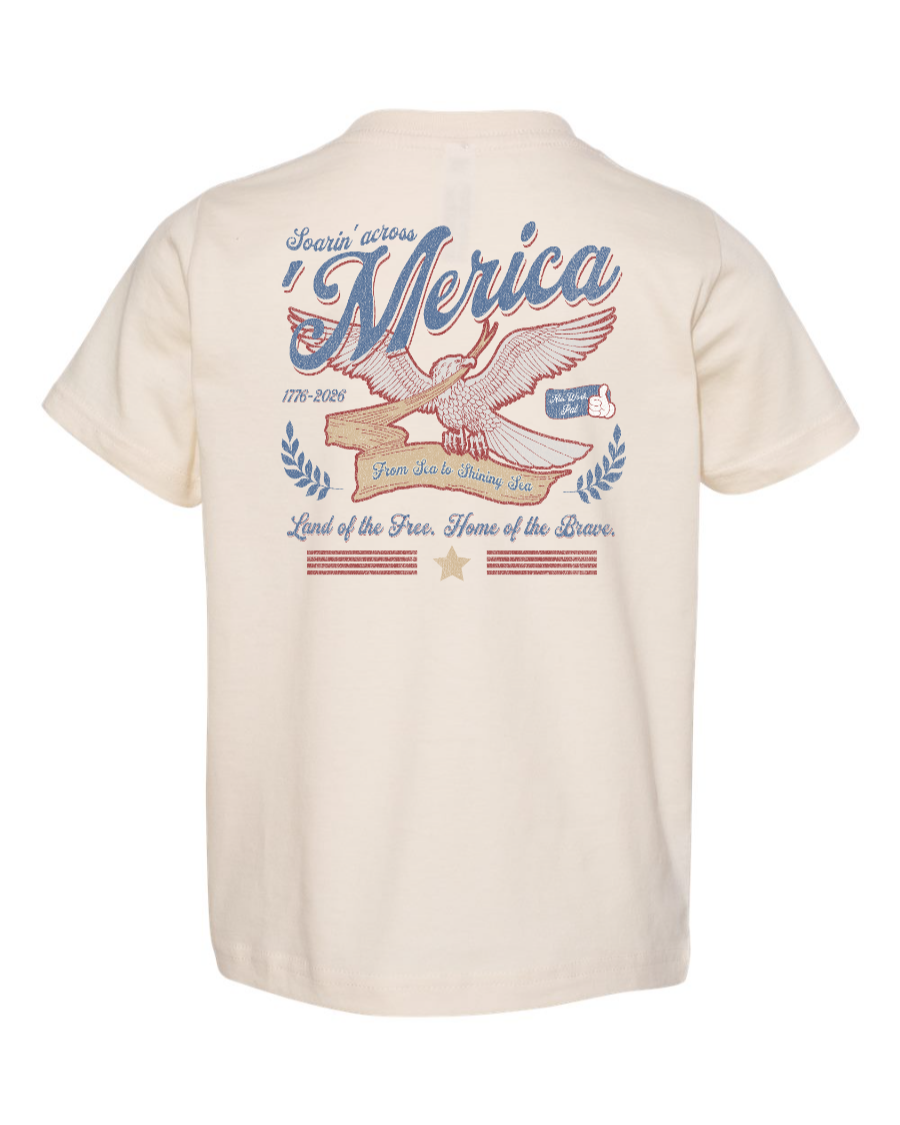 Toddler kids' tee by Corner of Main featuring a natural background design with patriotic "Soarin' Across 'Merica" print on the back.