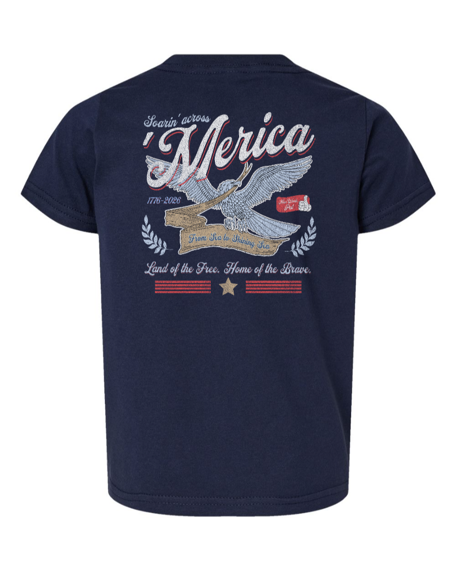 Navy toddler kids' shirt by Corner of Main featuring "Soarin' Across 'Merica" patriotic design on the back.