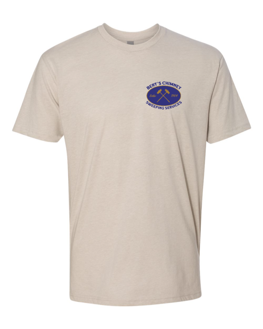 Corner of Main Next Level T-Shirt with Bert's Chimney Services logo on sand-colored fabric, displayed on a mannequin.