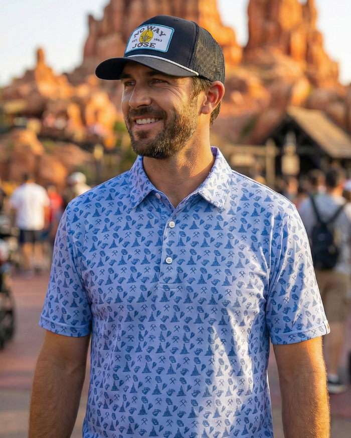 Corner of Main Big Thunder Mining Polo shirt in navy with logo, featuring a classic collar and short sleeves.