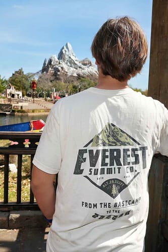 Teen looking at Expedition Everest in the Everest Summit Co tee