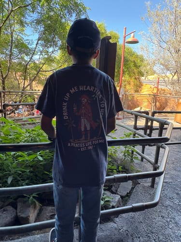 Customer at Disneyland in the A Pirate's Coffee Life tee